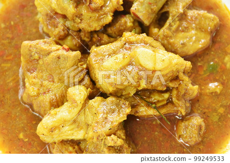 spicy boiled pork bone with curry and basil leaf on plate spicy boiled pork bone with curry and basil leaf on plate 99249533