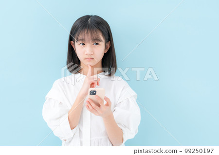 Girl worried smartphone 99250197