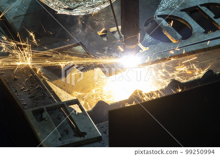 Close-up scene the argon gas cutting machine cutting the metal plate. 99250994