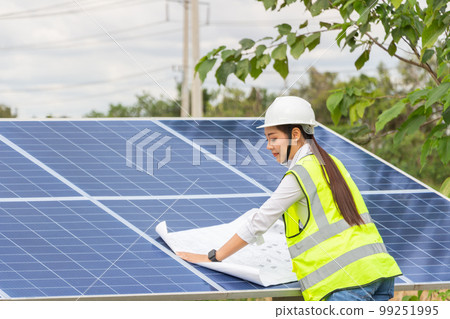 asian female and man Manager Engineer in Safety Helmet Checking With Tablet An Operation Of Solar Panel System At Solar Station in farm. asian female and man Manager Engineer in Safety Helmet Checking With Tablet An Operation Of Solar Panel System At Solar Station in farm. 99251995