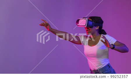 Cheerful Black Female Experiencing Virtual Reality In Modern Vr Glasses 99252357