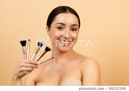 Beauty Concept. Attractive Indian Female With Set Of Makeup Brushes In Hand 99252590