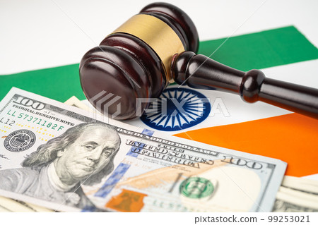 Gavel for judge lawyer and US dollar banknotes on India flag, finance concept. Gavel for judge lawyer and US dollar banknotes on India flag, finance concept. 99253021