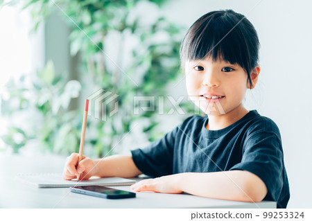 Elementary school girl learning online 99253324