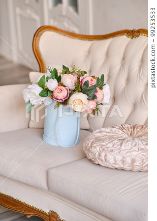 Large bouquet of decorative flowers in a pink hat box Large bouquet of decorative flowers in a pink hat box 99253533