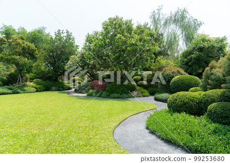 Scenic View of a Beautiful Landscape Garden with a Green Mowed Lawn Scenic View of a Beautiful Landscape Garden with a Green Mowed Lawn 99253680
