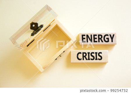 Global energy crisis symbol. Concept words Energy crisis on wooden blocks. Beautiful white table white background. Empty wooden chest. Business global energy crisis concept. Copy space. Global energy crisis symbol. Concept words Energy crisis on wooden blocks. Beautiful white table white background. Empty wooden chest. Business global energy crisis concept. Copy space. 99254732