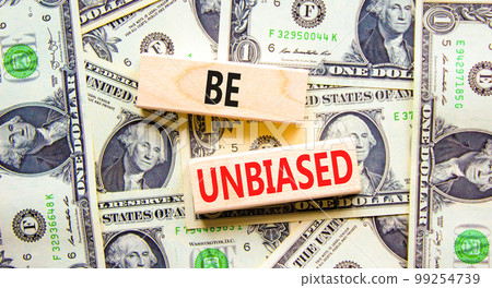 Be unbiased symbol. Concept words Be unbiased on wooden block. Beautiful background from dollar bills. Dollar bills. Business psychology be unbiased concept. Copy space. Be unbiased symbol. Concept words Be unbiased on wooden block. Beautiful background from dollar bills. Dollar bills. Business psychology be unbiased concept. Copy space. 99254739