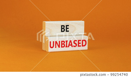 Be unbiased symbol. Concept words Be unbiased on wooden block. Beautiful orange table orange background. Business psychology be unbiased concept. Copy space. 99254740