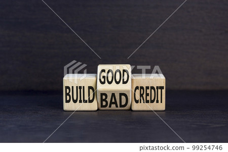 Build good or bad credit symbol. Concept word Build good or bad credit on wooden cubes. Beautiful black table black background. Business and build good or bad credit concept. Copy space. 99254746