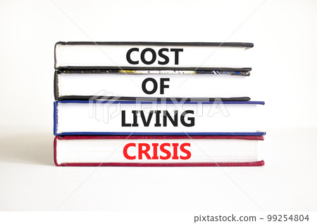 Cost of living crisis symbol. Concept words Cost of living crisis on books. Beautiful white table white background. Business cost of living crisis concept. Copy space. 99254804