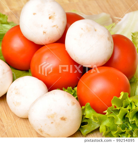 Assortment of organic fresh healthy vegetables, on bamboo cutting board 99254895