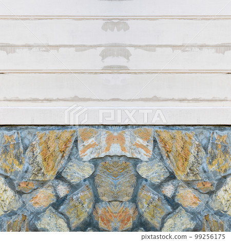 There is white painted wood paneling on the blue yellow ashlar wall There is white painted wood paneling on the blue yellow ashlar wall 99256175