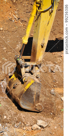 Excavator continues to work at the construction site Excavator continues to work at the construction site 99256386