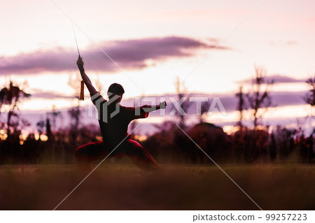 martial arts mid latin woman wushu kung-fu sword. healthy wellness active training. argentinean. martial arts mid latin woman wushu kung-fu sword. healthy wellness active training. argentinean. 99257223