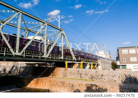 [Hankyu Kobe Main Line] Limited Express Train on the Kobe Line Crossing the Sumiyoshi River 99257470