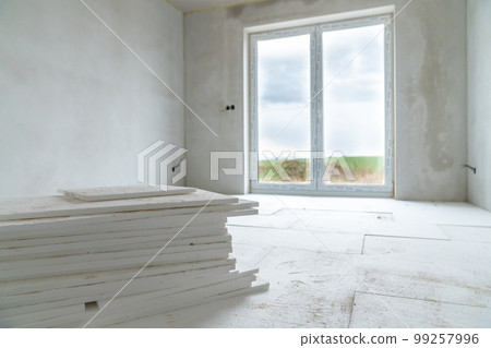 insulation of floors with polystyrene on the construction site insulation of floors with polystyrene on the construction site 99257996