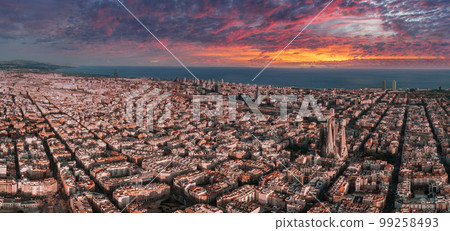 Aerial view of Barcelona City Skyline and Sagrada Familia Cathedral at sunset. Eixample residential famous urban grid. Cityscape with typical urban octagon blocks Aerial view of Barcelona City Skyline and Sagrada Familia Cathedral at sunset. Eixample residential famous urban grid. Cityscape with typical urban octagon blocks 99258493