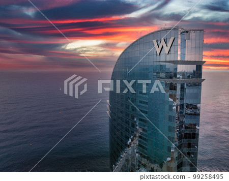 Panoramic aerial view of famous Barceloneta beach with hotel luxury W Barcelona. Birds eye of Barcelona, Catalunya, Spain. Panoramic aerial view of famous Barceloneta beach with hotel luxury W Barcelona. Birds eye of Barcelona, Catalunya, Spain. 99258495