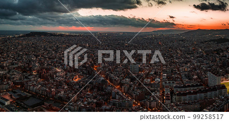 Barcelona street aerial view with beautiful patterns in Spain. Barcelona sunset skyline aerial view with buildings in Spain. Magical sunset over Barcelona. Barcelona street aerial view with beautiful patterns in Spain. Barcelona sunset skyline aerial view with buildings in Spain. Magical sunset over Barcelona. 99258517
