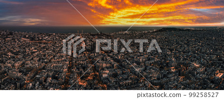 Aerial view of Barcelona City Skyline and Sagrada Familia Cathedral at sunset. Eixample residential famous urban grid. Cityscape with typical urban octagon blocks Aerial view of Barcelona City Skyline and Sagrada Familia Cathedral at sunset. Eixample residential famous urban grid. Cityscape with typical urban octagon blocks 99258527
