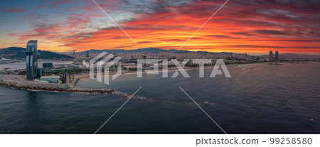 Panoramic aerial view of famous Barceloneta beach with hotel luxury W Barcelona. Birds eye of Barcelona, Catalunya, Spain. Panoramic aerial view of famous Barceloneta beach with hotel luxury W Barcelona. Birds eye of Barcelona, Catalunya, Spain. 99258580