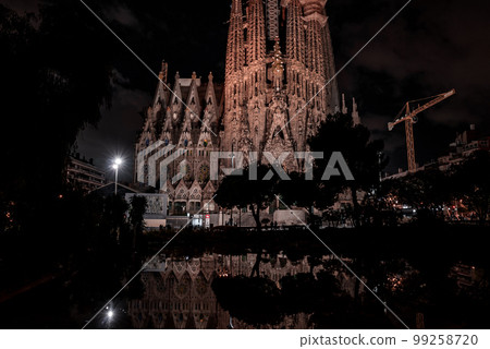 Night view of the La Sagrada Familia cathedral. Impressive cathedral designed and unfinished by Gaudi in the center of Barcelona. Night view of the La Sagrada Familia cathedral. Impressive cathedral designed and unfinished by Gaudi in the center of Barcelona. 99258720