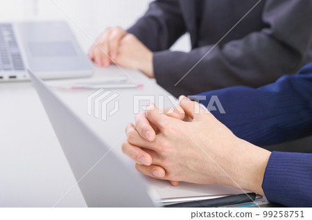 Business scene to hold a meeting using a personal computer Business scene to hold a meeting using a personal computer 99258751