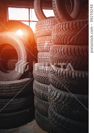 stack of car wheel tires at modern warehouse stack of car wheel tires at modern warehouse 99259248