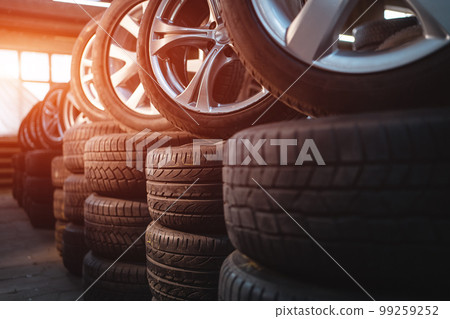 modern warehouse with stack of car tires 99259252