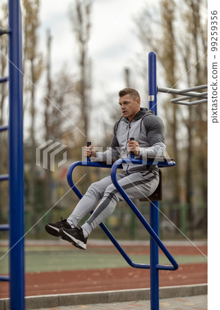 Athletic man in sportwear on the sports ground 99259356