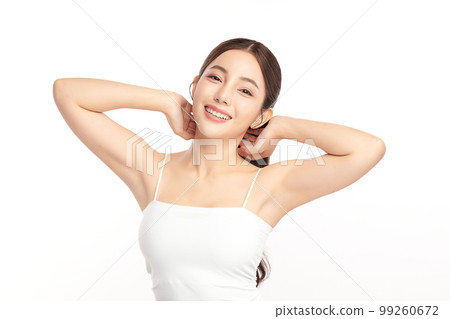 Beautiful Young Asian woman lifting hands up to show off clean and hygienic armpits or underarms on white background, Smooth armpit cleanliness and protection concept 99260672