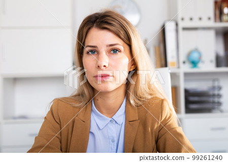 optimistic adult female person posing in white office optimistic adult female person posing in white office 99261240