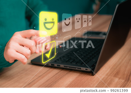 Man hand using computer laptop with popup five star icon for feedback review satisfaction service and testimonial. Customer service experience and business satisfaction survey. 99261399