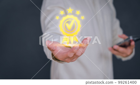 Adult man shows the sign of the top service the best quality assurance with golden five stars. Quality assurance of business services, Guarantee, Standards, ISO certification and testimonial concept. Adult man shows the sign of the top service the best quality assurance with golden five stars. Quality assurance of business services, Guarantee, Standards, ISO certification and testimonial concept. 99261400