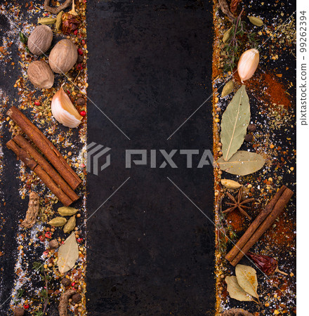 Different spices and herbs on a black background 99262394