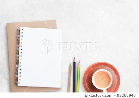 Blank notebook or notepad,pencil with office tools and cup of coffee on white office desk Blank notebook or notepad,pencil with office tools and cup of coffee on white office desk 99263946