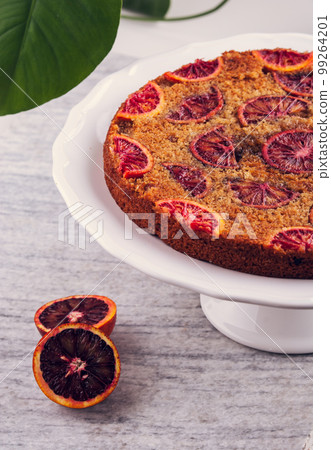delicious cake with red oranges slices on top 99264201