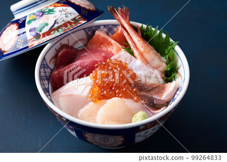 Bowl of rice topped with sashimi Bowl of rice topped with sashimi 99264833
