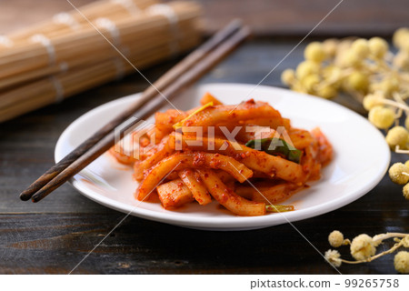Kimchi radish on wooden background, Korean food homemade side dish 99265758