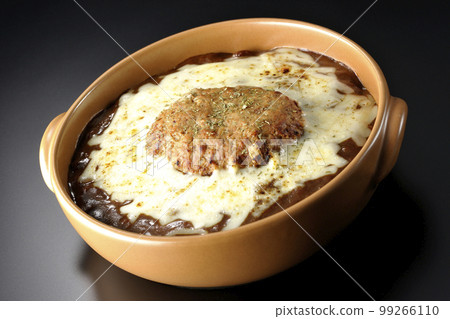 A grilled curry with plenty of cheese and hamburger on a black background 99266110