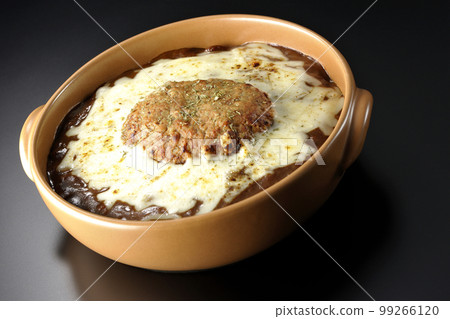 A grilled curry with plenty of cheese and hamburger on a black background 99266120
