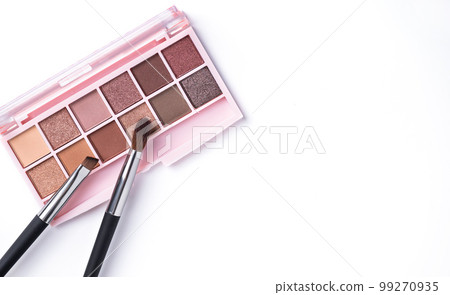 Beige eye shadow palette top view. Decorative cosmetics. Beauty products. Nude brown eye shadow. 99270935