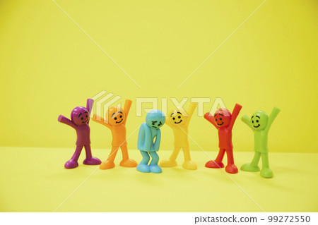 A colorful doll that looks happy to comfort a depressed person 99272550