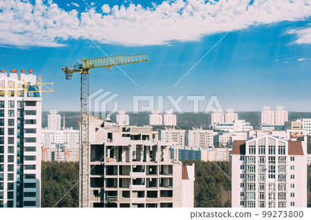 New Accommodation Concept. Amazing Bright Blue Sky Above Construction Crane. Construction And Development Of New Multi-storey Residential. Conception Of Development 99273800
