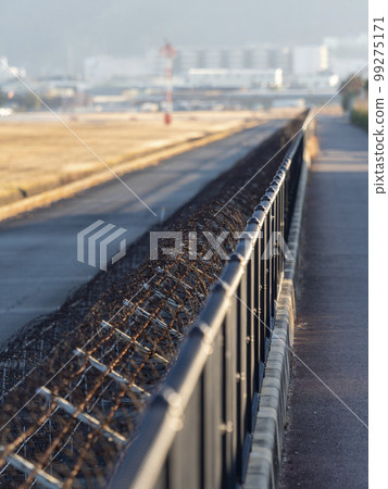 Fences and barbed wire at the airport 99275171
