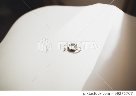 Beautiful toned picture with wedding rings Beautiful toned picture with wedding rings 99275707