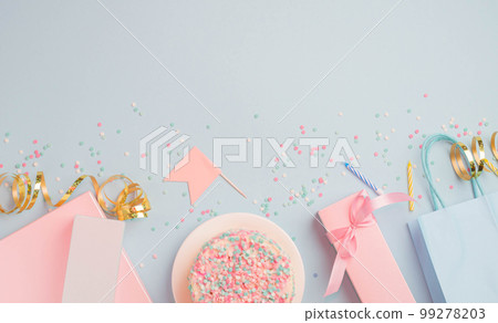 Gift boxes serpentine confetti and glitter packages, festive blue background. Party birthday concept Gift boxes serpentine confetti and glitter packages, festive blue background. Party birthday concept 99278203