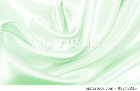 Smooth elegant green silk or satin luxury cloth texture as abstract background. Luxurious background design 99278830