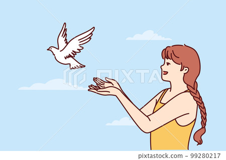 Little girl volunteers teenager sets dove free and lets bird fly towards sky for family reunion Little girl volunteers teenager sets dove free and lets bird fly towards sky for family reunion 99280217